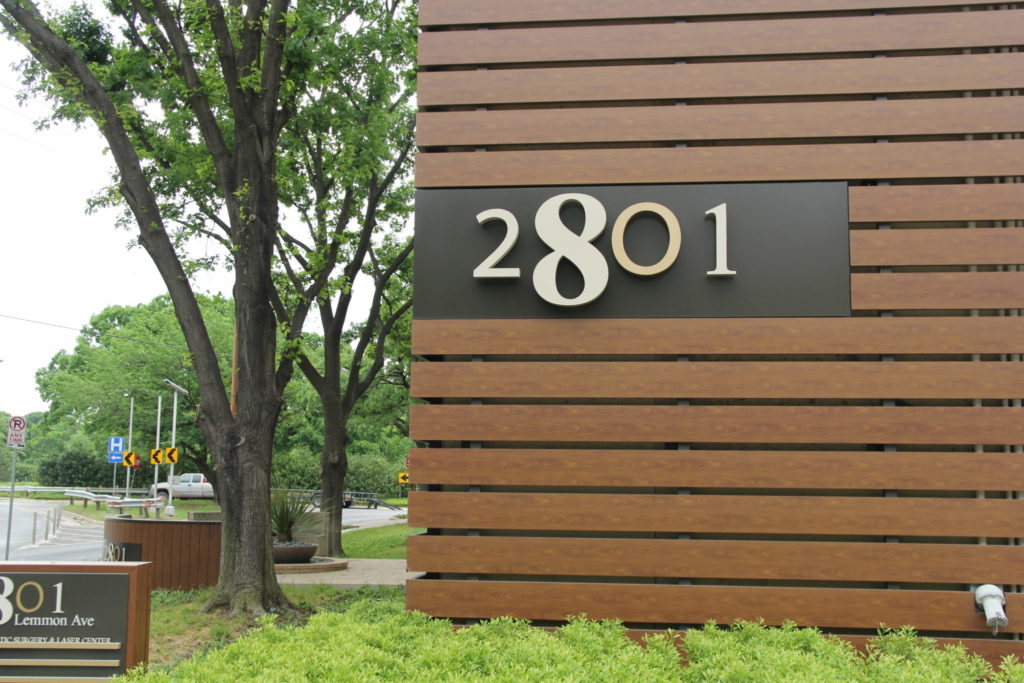The number 2801 on wood paneling denoting the exterior location of Oak Lawn Center