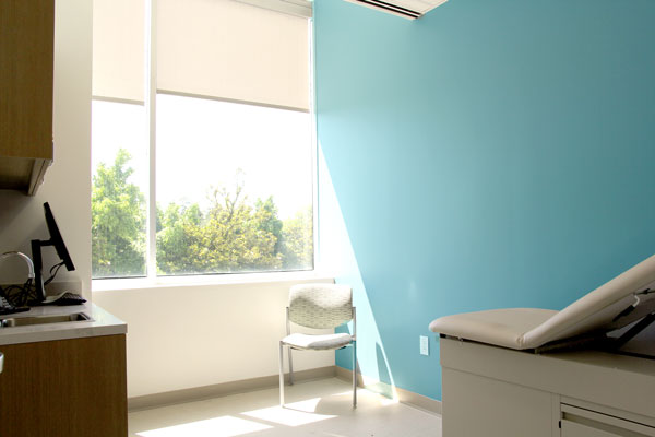 medical exam room at Oak Lawn Center with a light blue wall and natural light